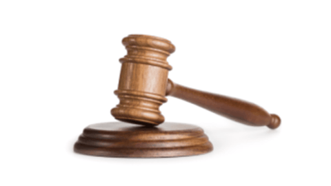 A judges gavel on a white background