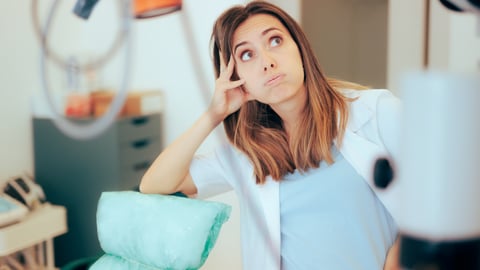 Young doctor puffing her cheeks out in frustration