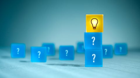blue blocks with questij marks and one yellow block with a lightbulb