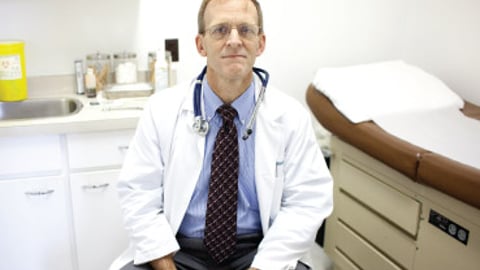 Doctor sitting in his clinic