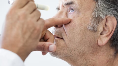 Elderly man examined by an ophthalmologist