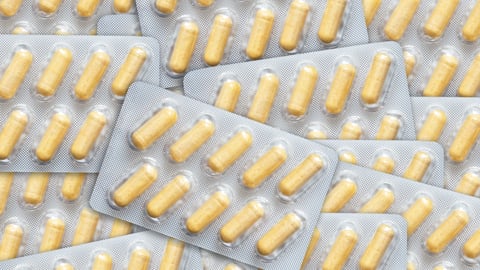 Packets of yellow pill capsules