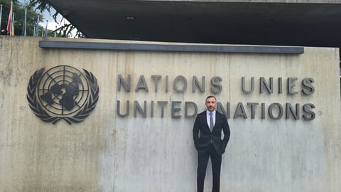 Sherif Guorgui standing in front of the United Nations