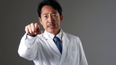 Angry male doctor shouting and pointing
