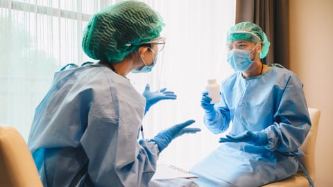 Nurse and Doctor arguing about about medical treatment in hospital during covid-19 pandemic situation.