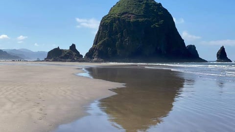 A large rock at the seashore in Oregon by Julie Melmoth