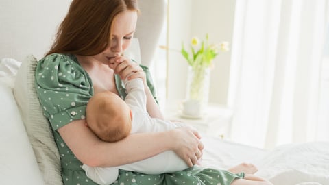 woman breastfeeding her baby