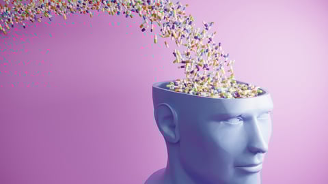 Cartoon of many pills cascading into someone's open head