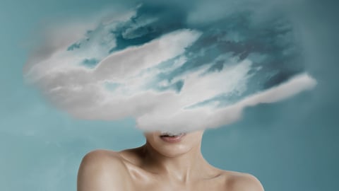 A woman with a cloud obscuring the top of her head