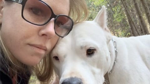 pharmacy technician Alicia Levman and her dog