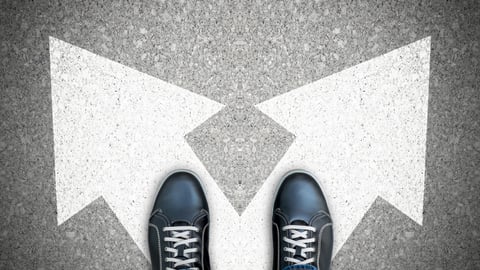 2 feet standing on arrows that diverge in two directions