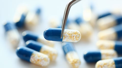 Blue and white capsule pills