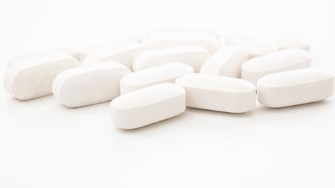 Close up of White Pills Isolated on White Background are ready to use for treatment