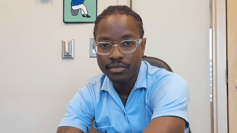Dr. Josiah Osagie sitting for a photo