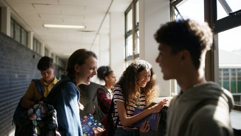 High school students hanging out in the hallway