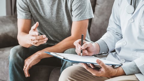 A doctor consulting with a patient.