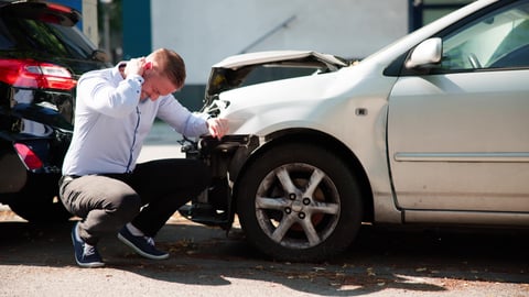 A young man seeks compensation after injury from a car accident causing whiplash pain.