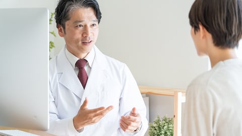 A pharmacist chatting with a patient