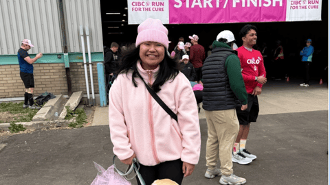 Asian female in pink and her dog in a pink shirt