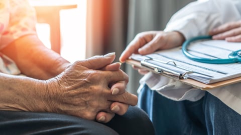Geriatric doctor consults with an elderly patient in a medical clinic