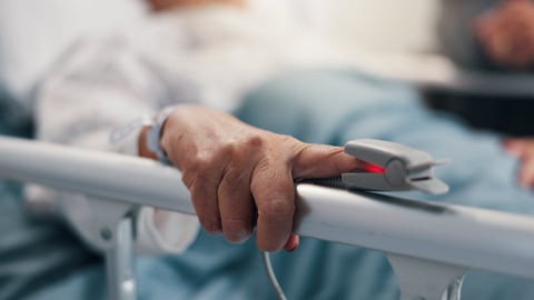 Older man in a hospital bed