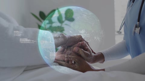 Healthcare worker holding hands with a patient