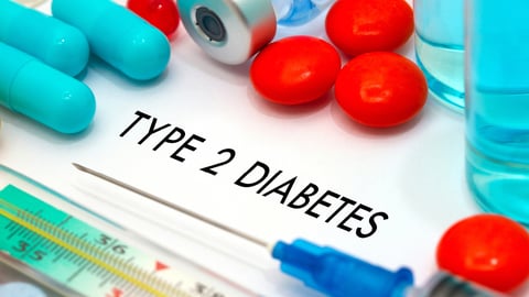 A pile of pills surrounding the word 'T2 Diabetes'