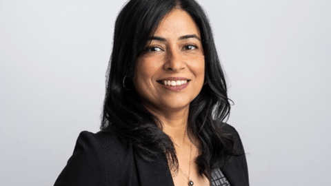 dark skinned woman in suit jacket