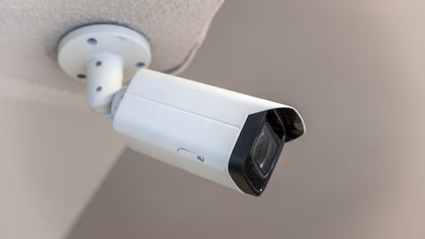 A ceiling-mounted indoor surveillance camera.