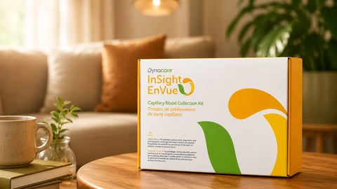Dynacare at-home blood tests sit in a box on a coffee table in a warmly-lit home