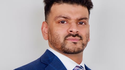 Dr. A. Zohaib Siddiqi.jpeg posing for a photo in a blue suit 