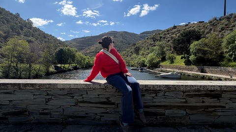 Dr. Bridgette Chan sitting on a wall outside