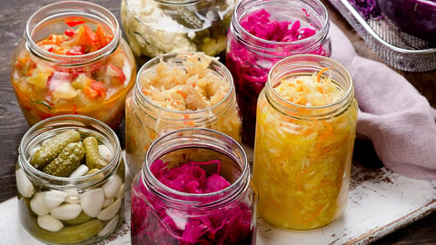 Several jars of colourful fermented foods