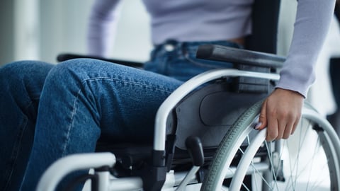 A person using a wheelchair.