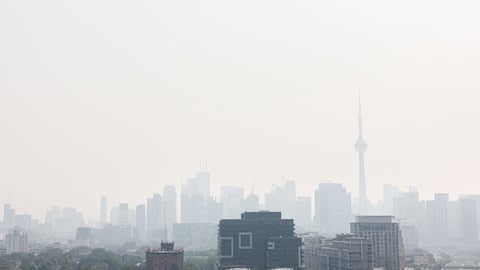 Smoke from wildfires cast haze over the Toronto skyline.