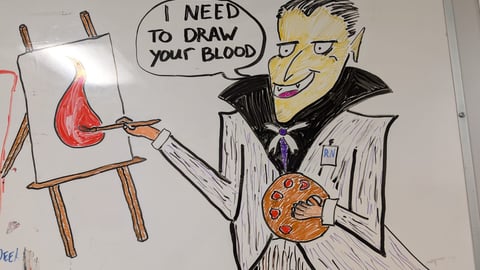 An illustration featuring Count Dracula with a nursing badge saying, “I need to draw your blood,” while painting a literal droplet of blood on an easel. (Dave Falconer) 