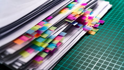 A pile of colour-coded paperwork