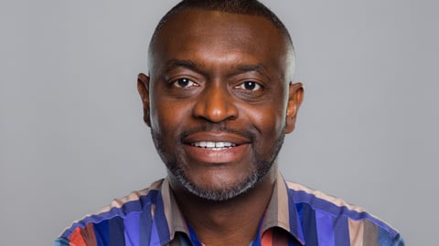 Dr. Olukayode Olutunfese with stripped shirt.