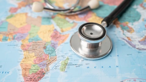 A stethoscope on a world map.