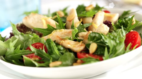 close up of green salad with chicken chunks