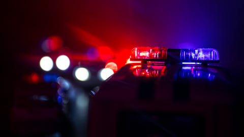Police cars at night. Police car chasing a car at night with fog background. 911 Emergency response police car speeding to scene of crime. Selective focus; Shutterstock ID 1191163906