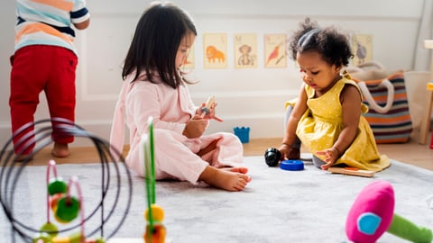 Little kids playing toys in the playroom; Shutterstock ID 1241563456