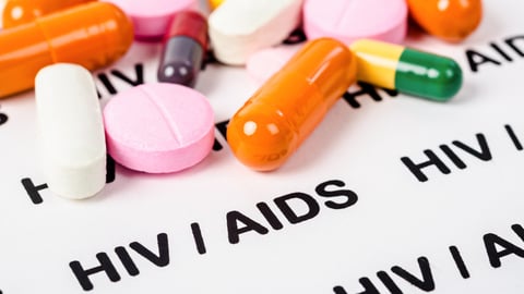 Pills on Hiv / aids paper background.; Shutterstock ID 1522630529
