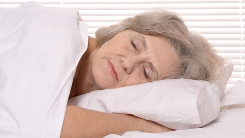 Beautiful older woman sleeping in the bedroom; Shutterstock ID 165088814