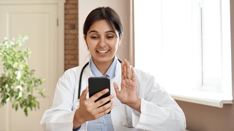 Smiling indian female doctor holding phone talk to patient make telemedicine online conference video call. Gp remote consultation telemedicine virtual mobile health care chat app. Telehealth in India.; Shutterstock ID 1779961871