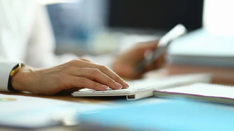 Nurse type text. Woman in white coat hold her hand on white keyboard. Doctor press button with her finger. On table are document, paper, form. Specialist serves population in workplace.; Shutterstock ID 1783657661