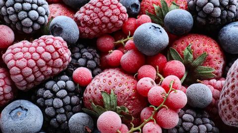 Mix of different frozen berries as background, top view; Shutterstock ID 1796853346