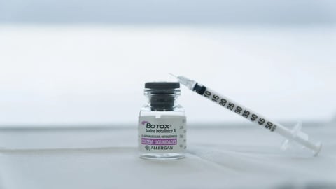 Porto Alegre , Brazil,April 10 - 2021: Botox glass medicine bottle,.Syringe of botulinum toxin, hualuronic, collagen or flu on a white background; Shutterstock ID 1957060963