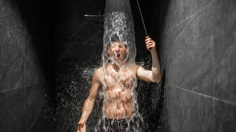 Man hardening with bucket of ice cold water after hot sauna, healthy lifestyle and cold training concept. Wellness and spa.; Shutterstock ID 1975699040