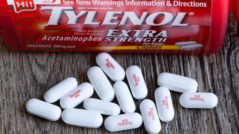 Washington, D.C, USA - July 3rd, 2021: Closeup view of bottle Of Tylenol Extra Strength With Many Pills On A Wooden Table Which Was Sold Out During Covid-19 time for reducing fever, headache; Shutterstock ID 2001375902